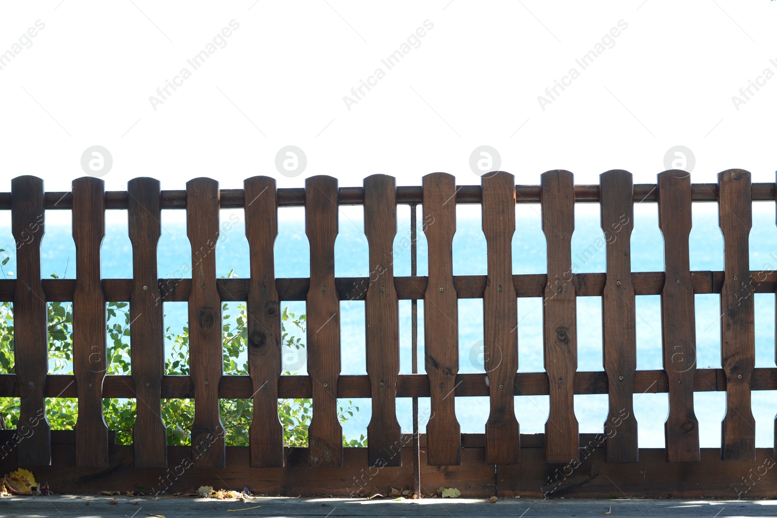 Photo of Wooden fence against sky on sunny day outdoors