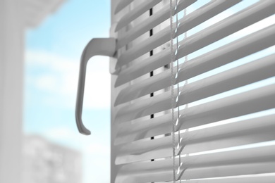 Photo of Closeup view of window with blinds. Space for text