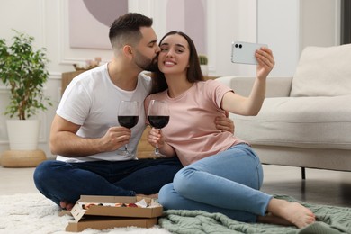 Photo of Affectionate young couple spending time together at home