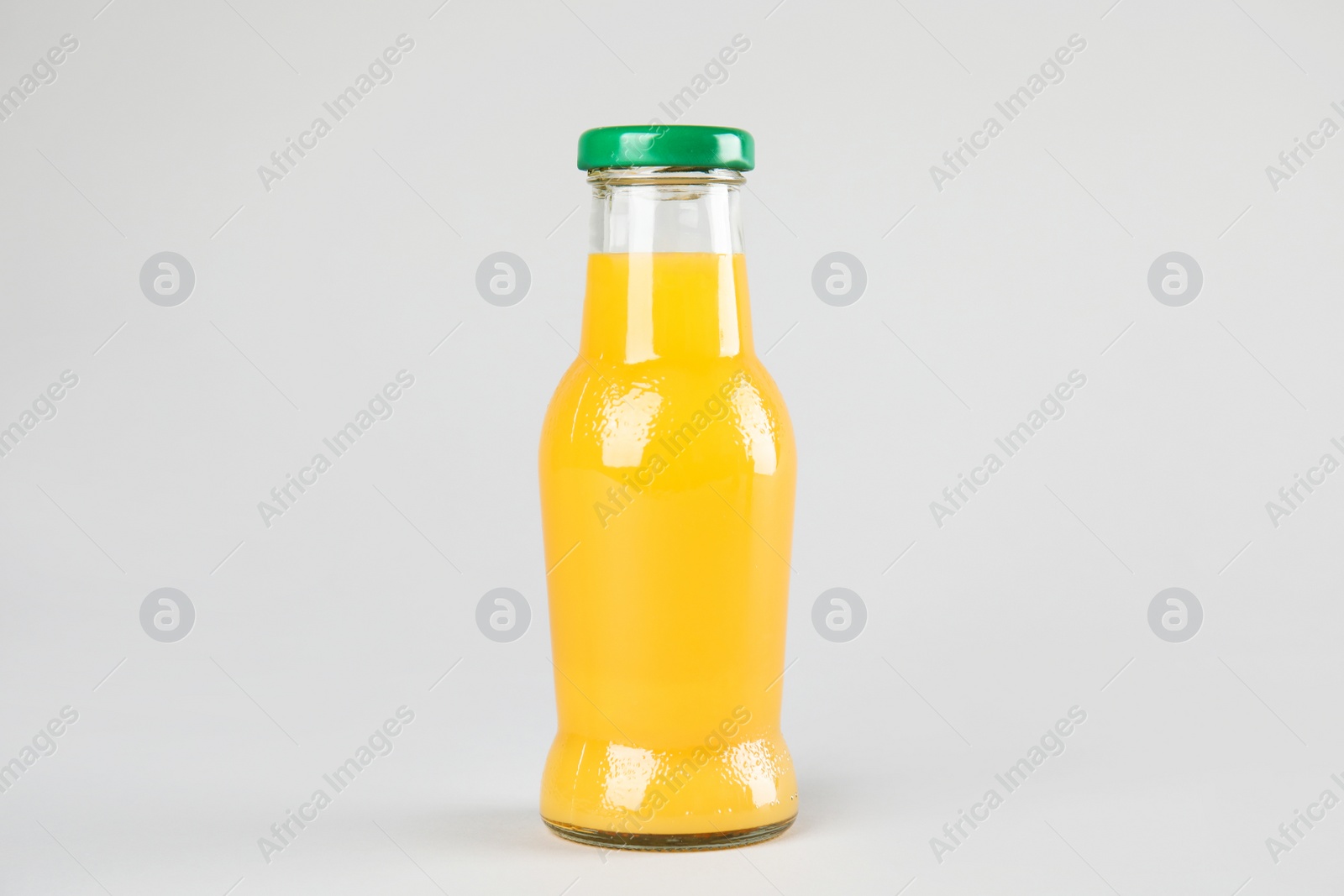 Photo of One bottle with tasty drink on color background