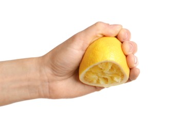 Photo of Woman squeezing lemon half on white background, closeup