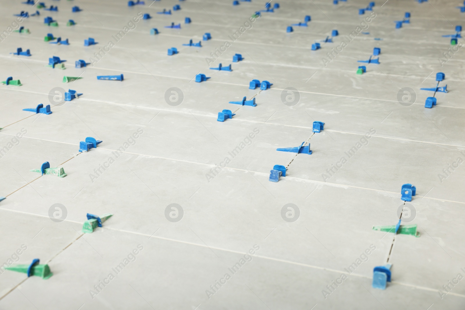 Photo of Beautiful tiles with colorful wedges as background, closeup