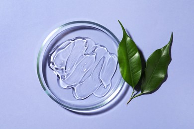 Photo of Petri dish with sample and leaves on lilac background, flat lay
