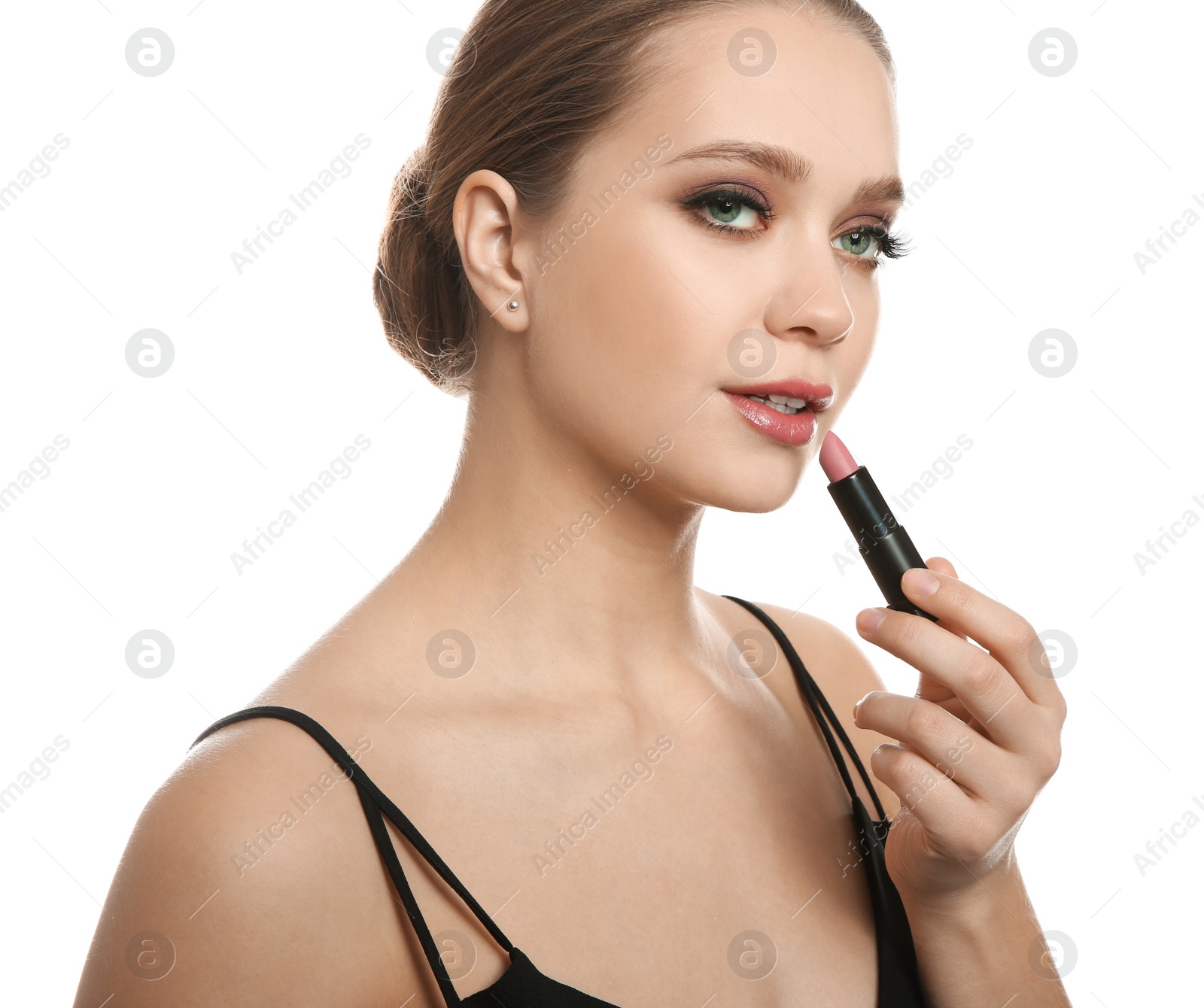 Photo of Beautiful woman applying lipstick on white background. Stylish makeup