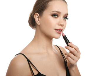 Photo of Beautiful woman applying lipstick on white background. Stylish makeup