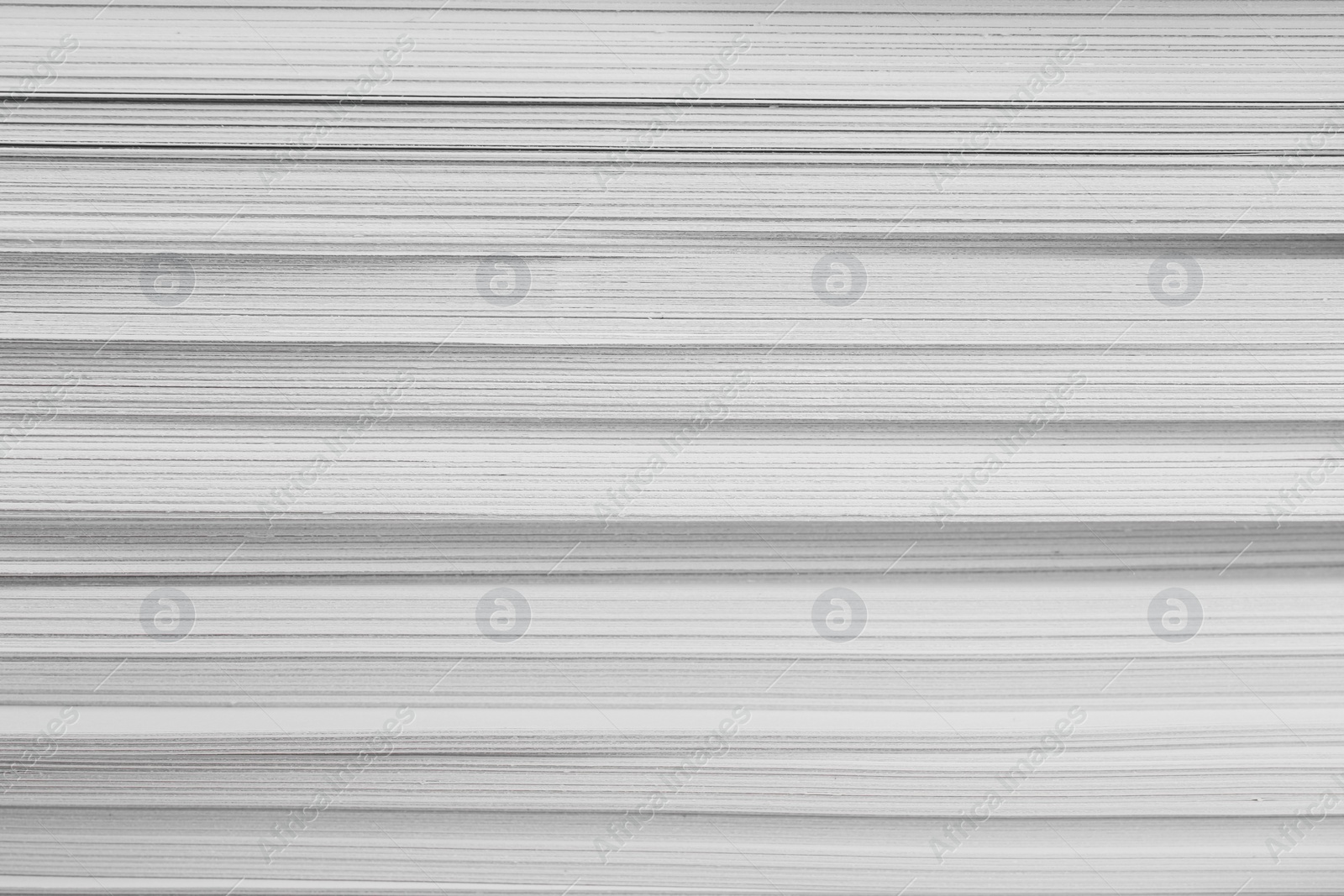 Photo of Stack of white paper sheets, closeup view