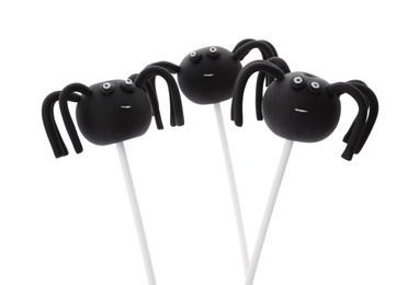 Photo of Delicious spider cake pops on white background. Halloween season