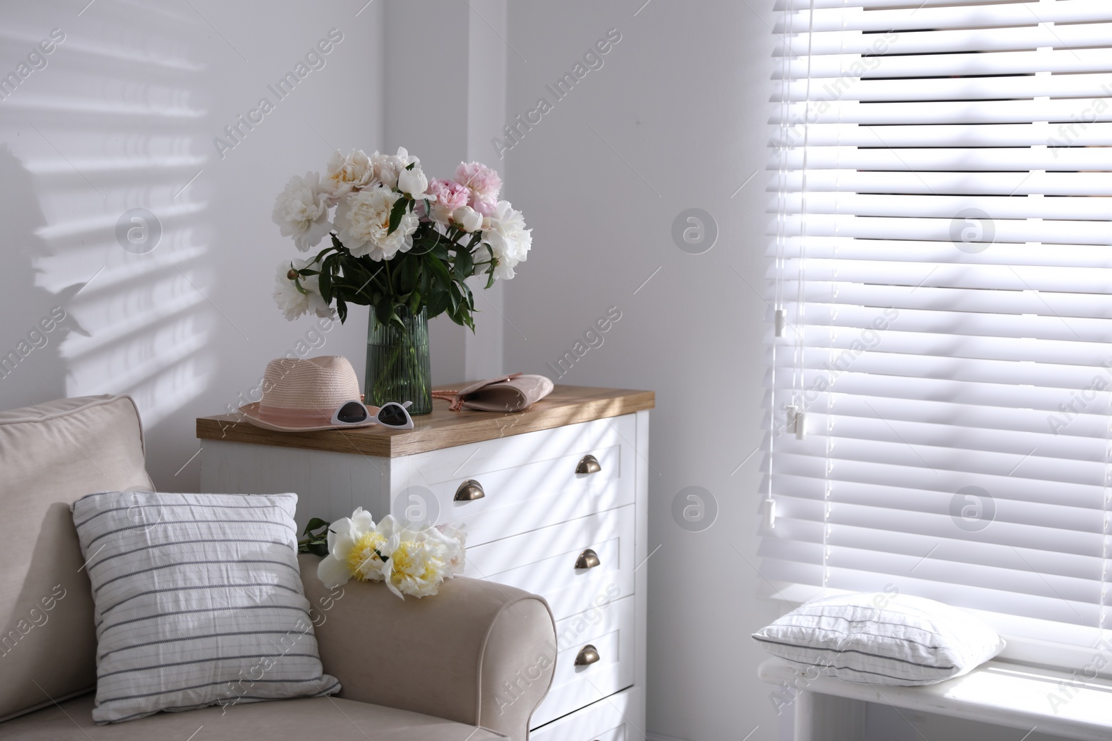 Photo of Bouquet of beautiful peony flowers in room