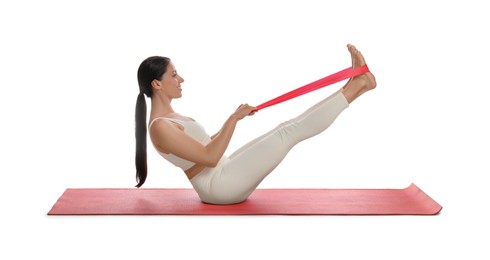 Photo of Woman doing sportive exercise with fitness elastic band on white background