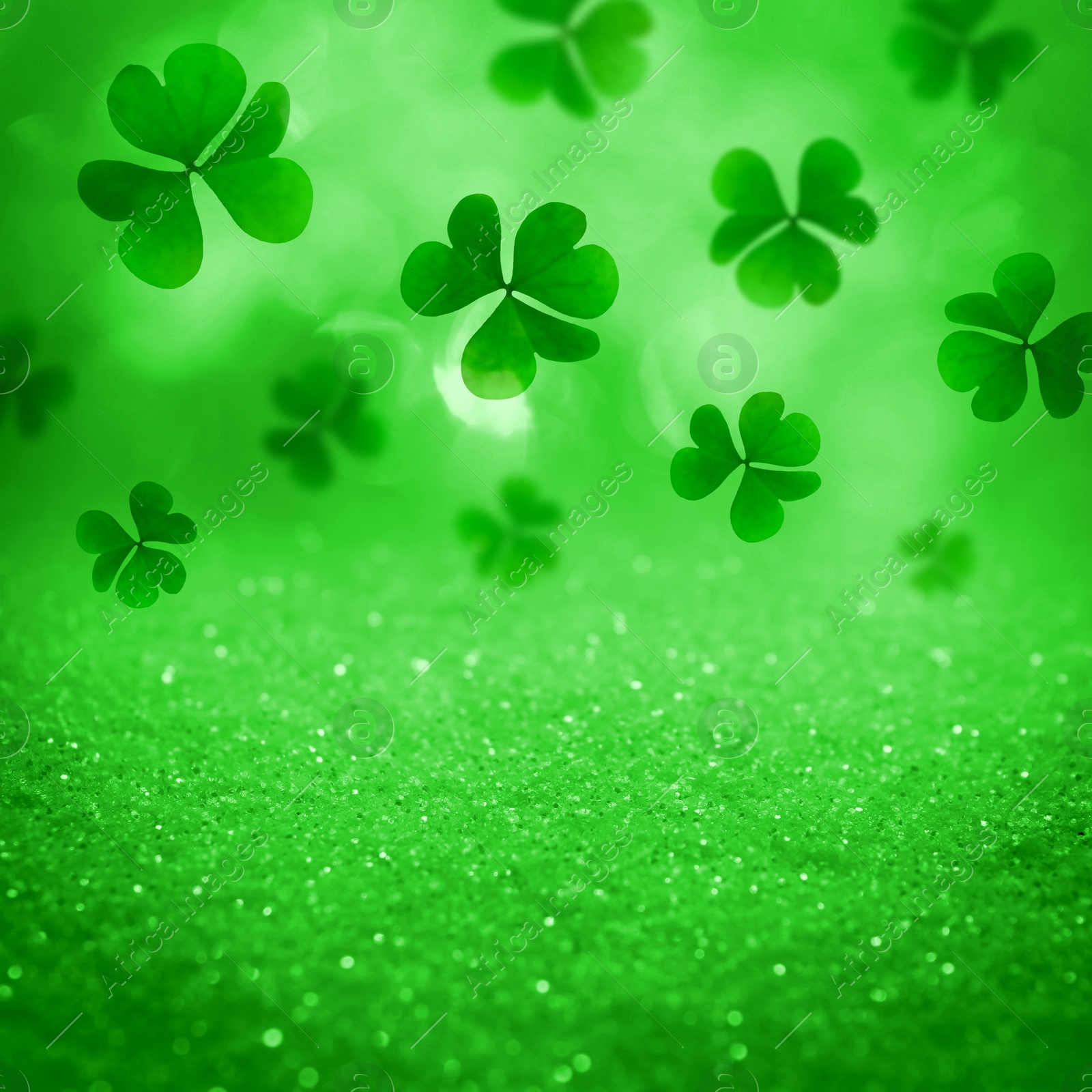 Image of St. Patrick's Day celebration. Clover leaves on green background