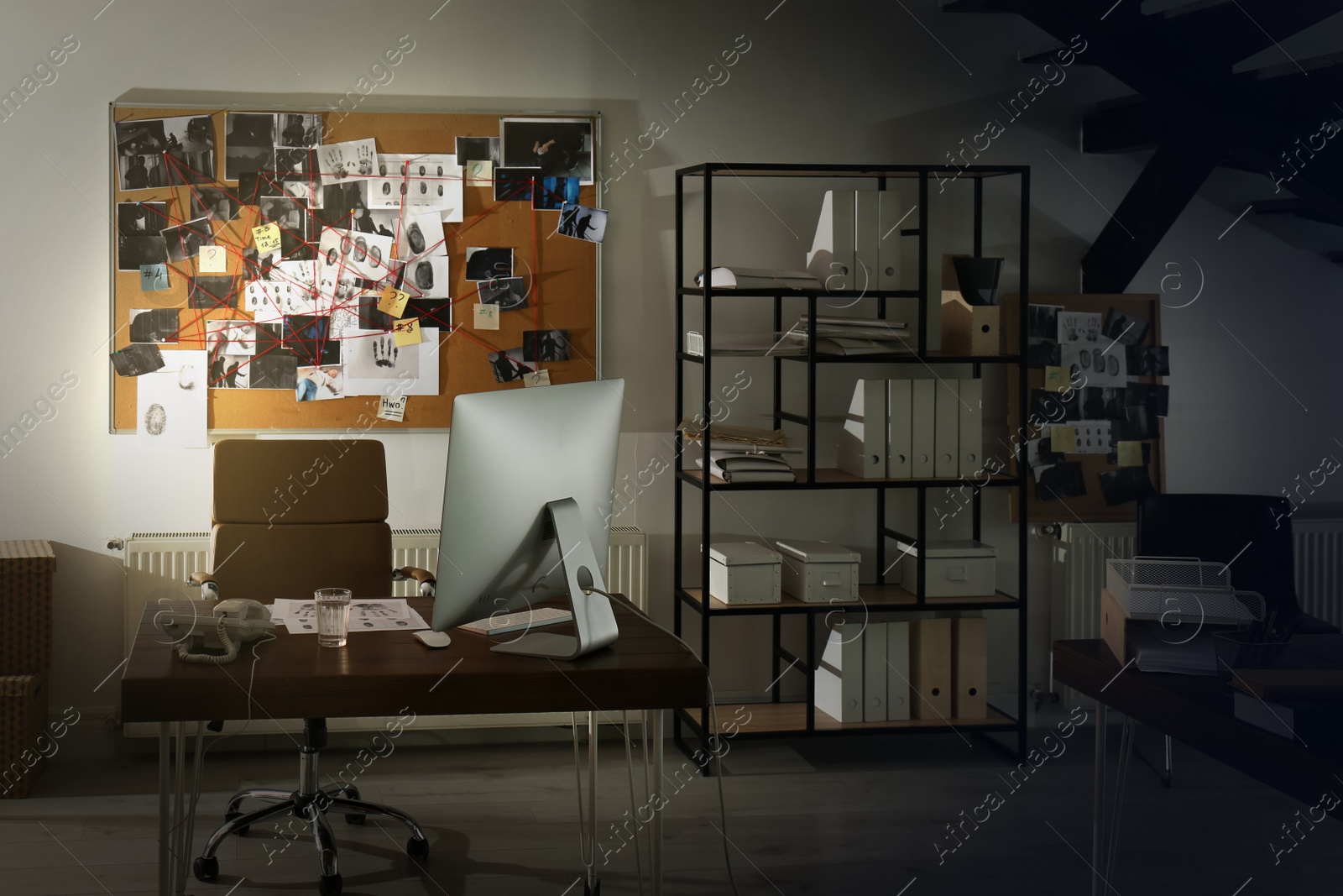 Photo of Modern detective office with computer and board