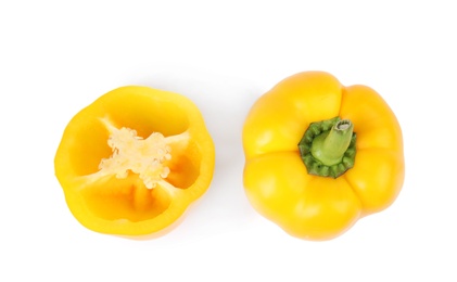 Photo of Whole and cut yellow bell peppers isolated on white, top view