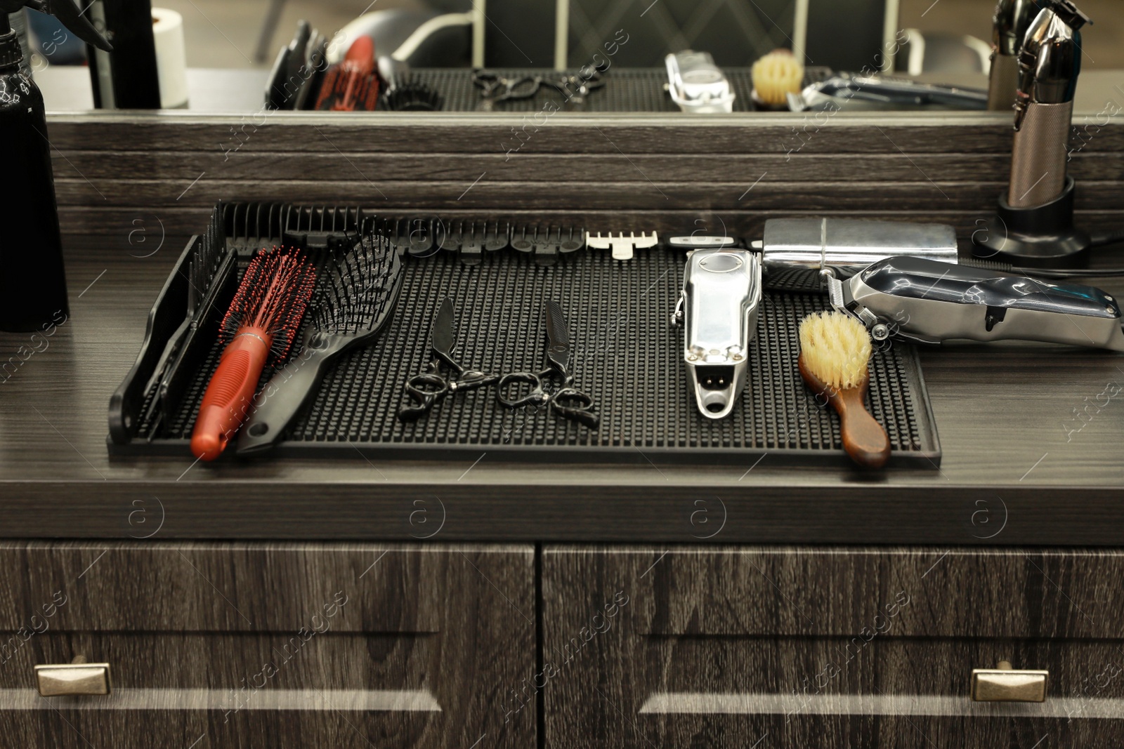 Photo of Stylish hairdresser's workplace with professional tools in barbershop