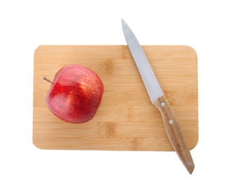 Photo of Wooden cutting board with apple and utility knife isolated on white, top view