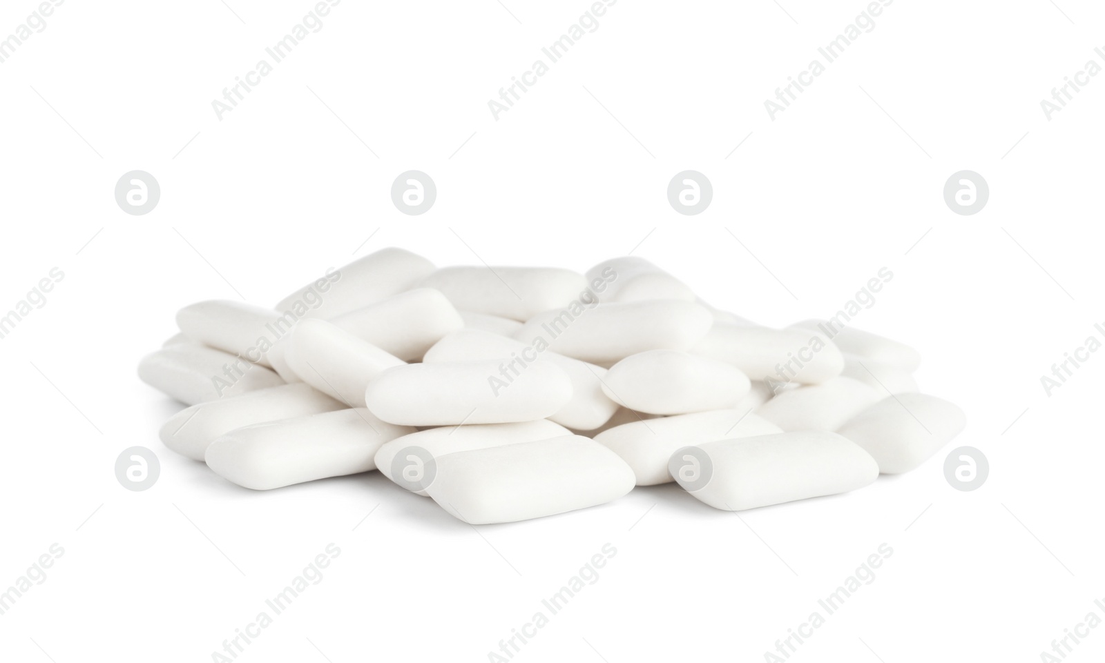 Photo of Heap of chewing gum pieces on white background