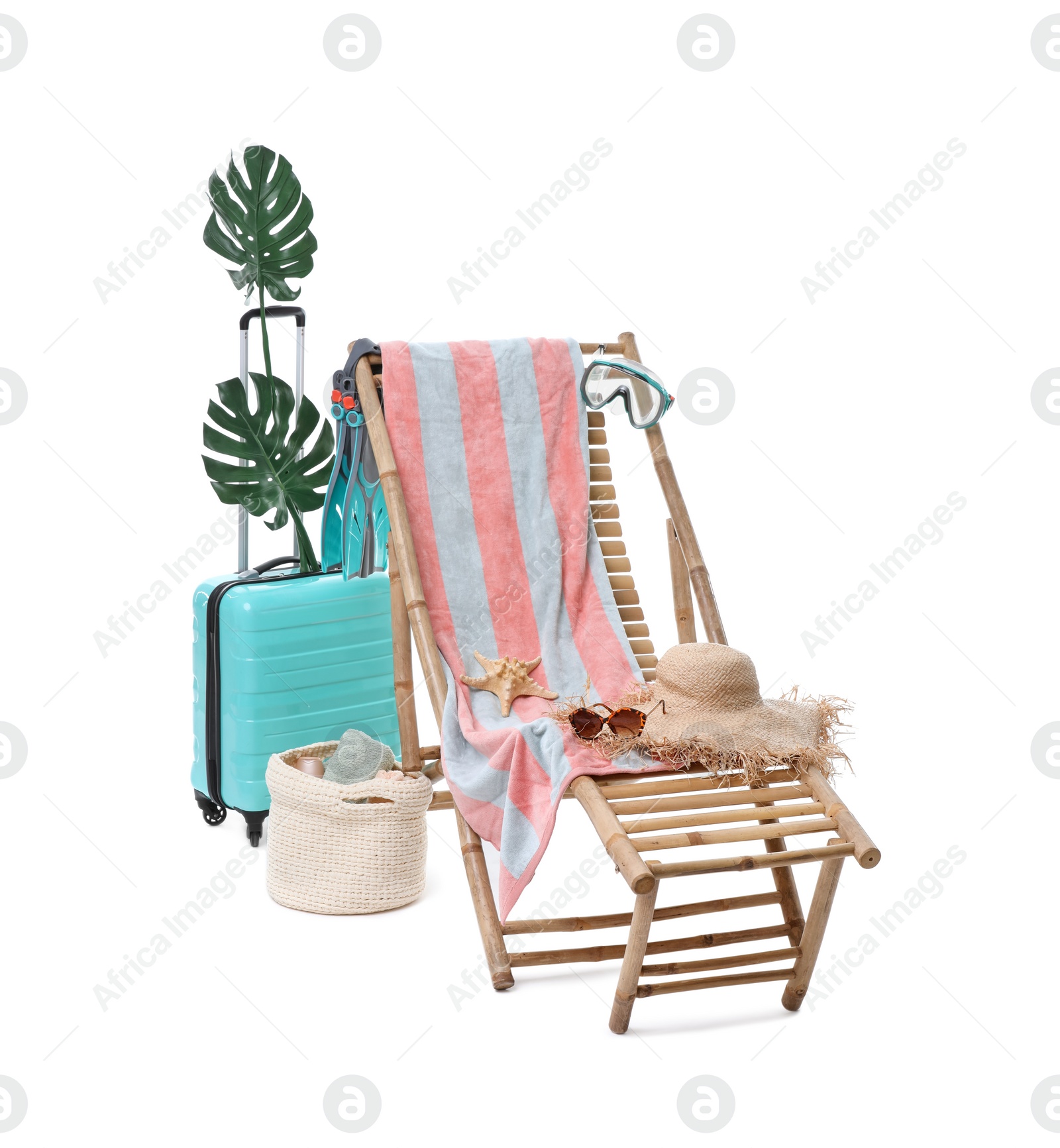 Deck chair, suitcase and beach accessories isolated on white Photo of Deck chair, suitcase and beach accessories isolated on white