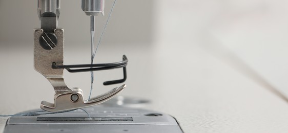 Image of Dressmaking workshop. Sewing machine, closeup. Banner design with space for text