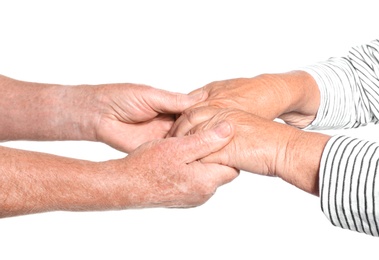 Photo of Elderly people holding hands together on white background. Help and support concept
