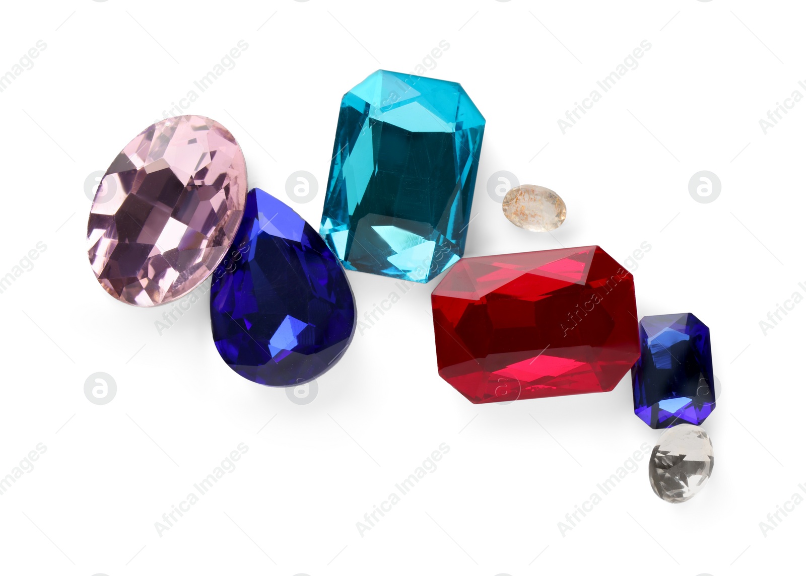 Photo of Different beautiful gemstones for jewelry isolated on white, top view