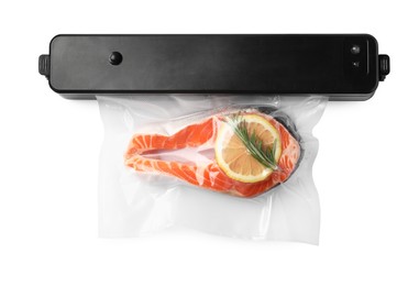 Photo of Vacuum packing sealer and plastic bag with salmon on white background, top view