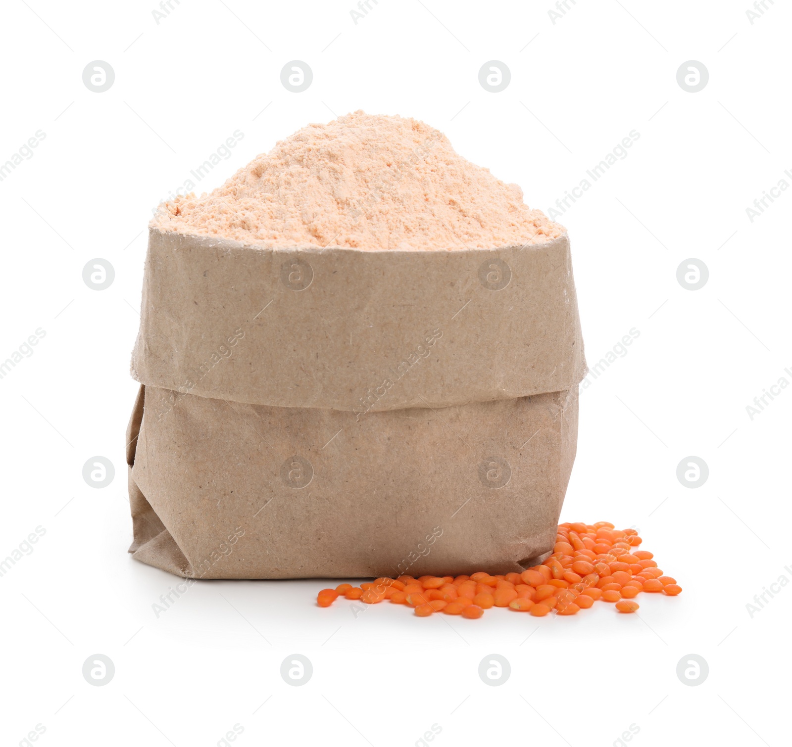 Photo of Paper bag with lentil flour and grains on white background