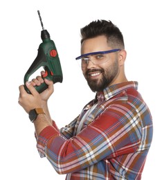 Photo of Young man in protective goggles with power drill on white background