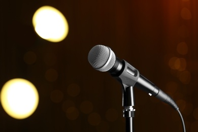 Photo of Microphone against festive lights, space for text