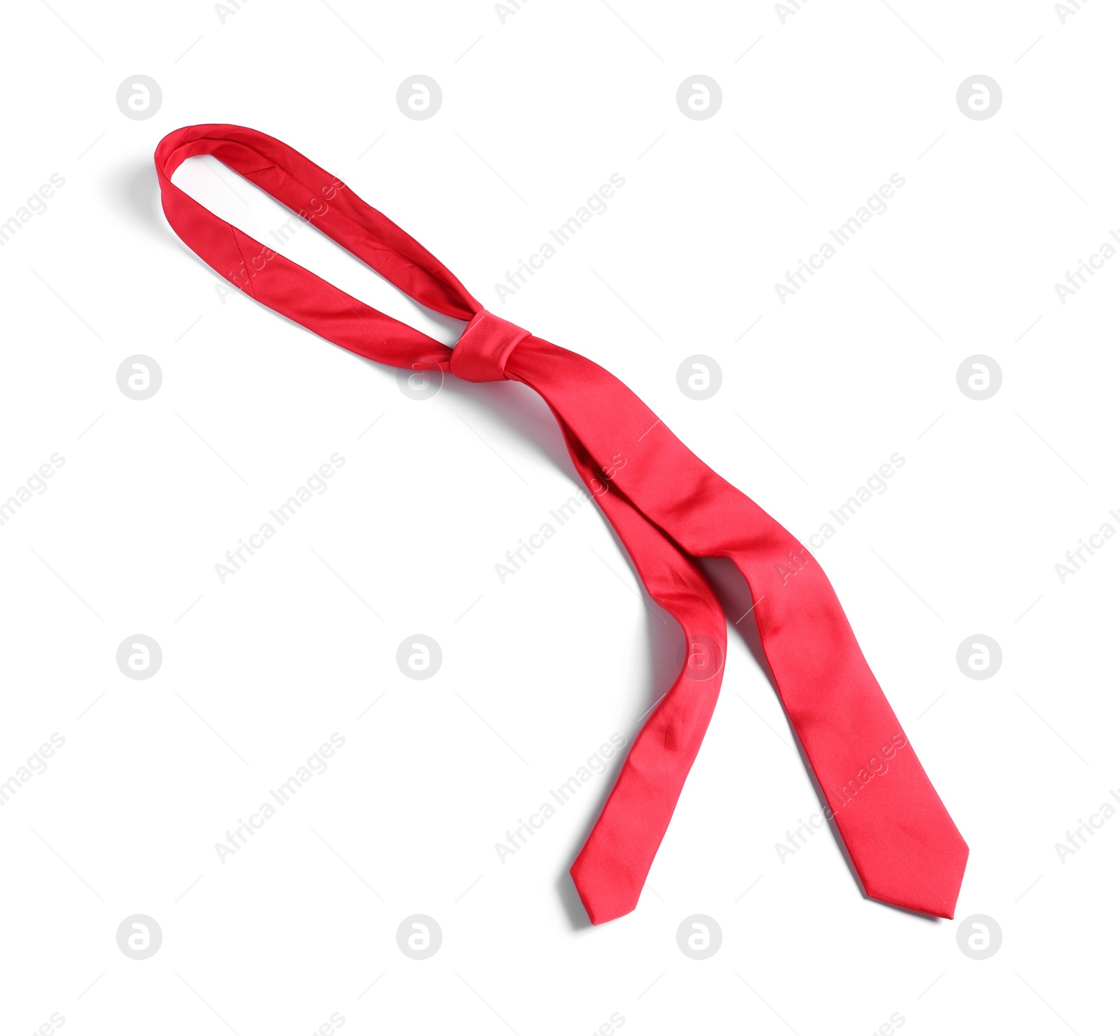 Photo of One red necktie isolated on white, top view