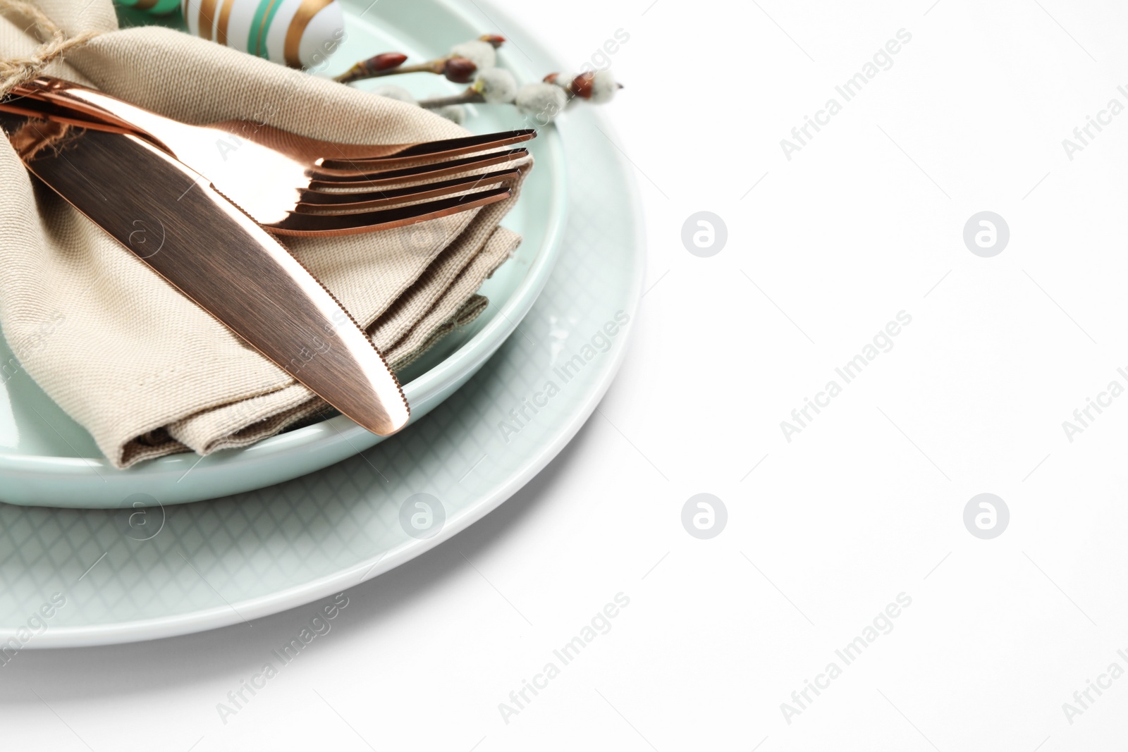 Photo of Festive Easter table setting with floral decor on white background, closeup