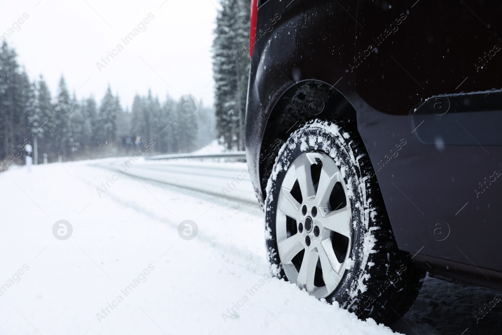 Photo of Car on snowy winter day, closeup view. Space for text