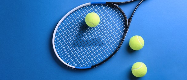 Image of Tennis racket and balls on blue background, flat lay. Banner design