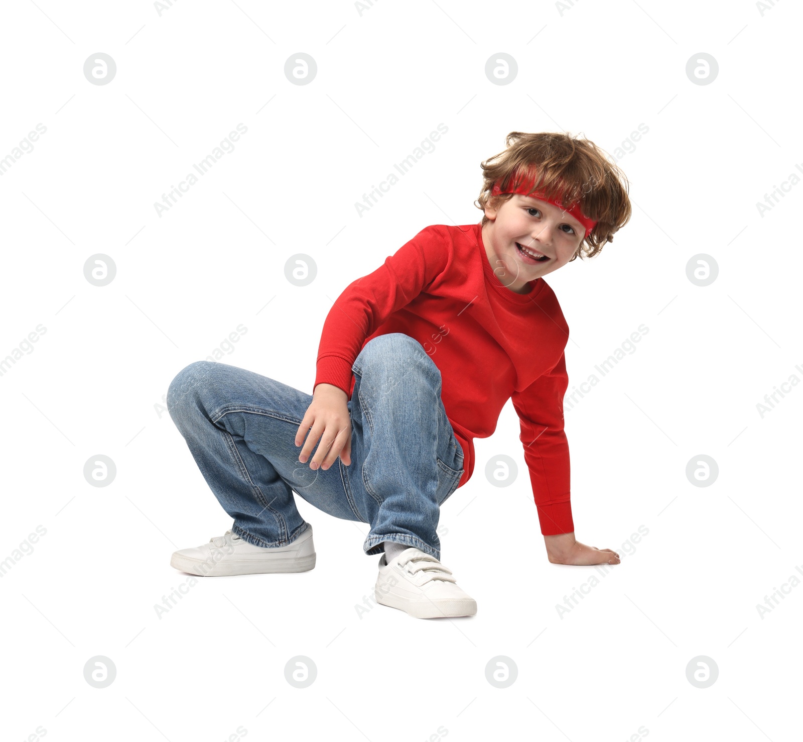 Photo of Happy little boy dancing on white background