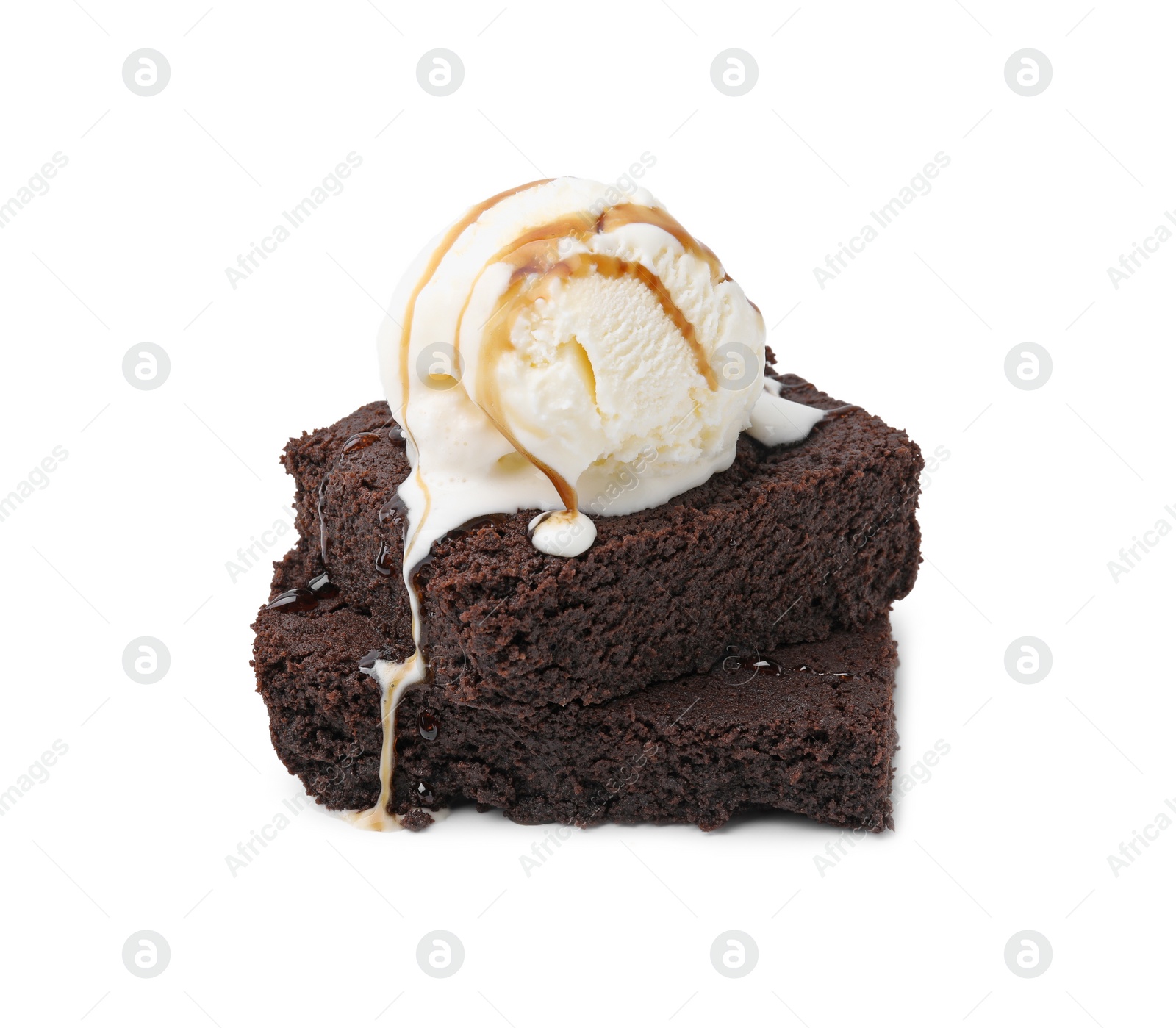 Photo of Tasty brownies with ice cream and caramel sauce isolated on white