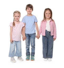 Photo of Group of cute children holding hands on white background