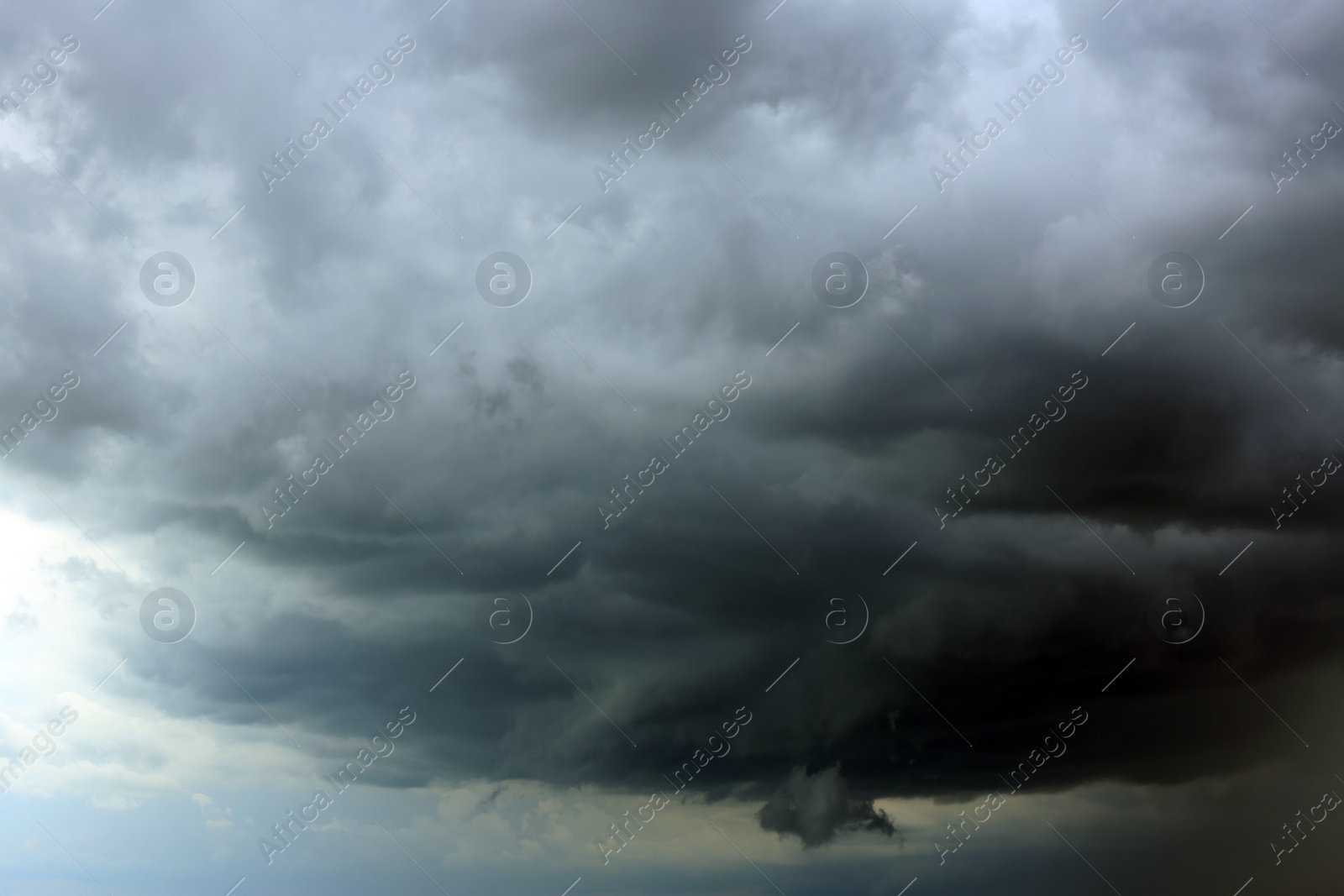 Photo of Sky with heavy rainy clouds on grey day