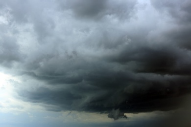 Sky with heavy rainy clouds on grey day