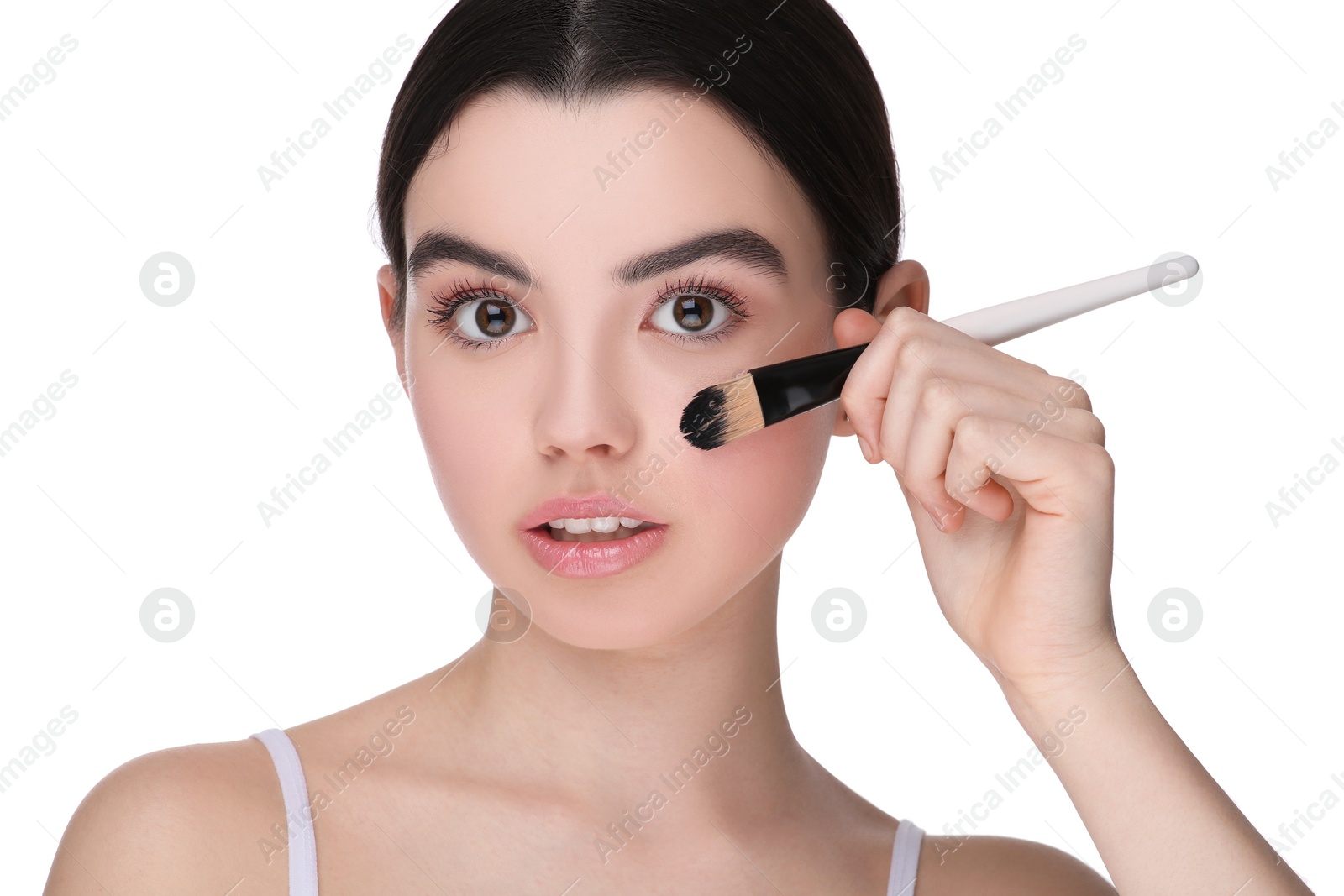 Photo of Teenage girl with makeup brush on white background