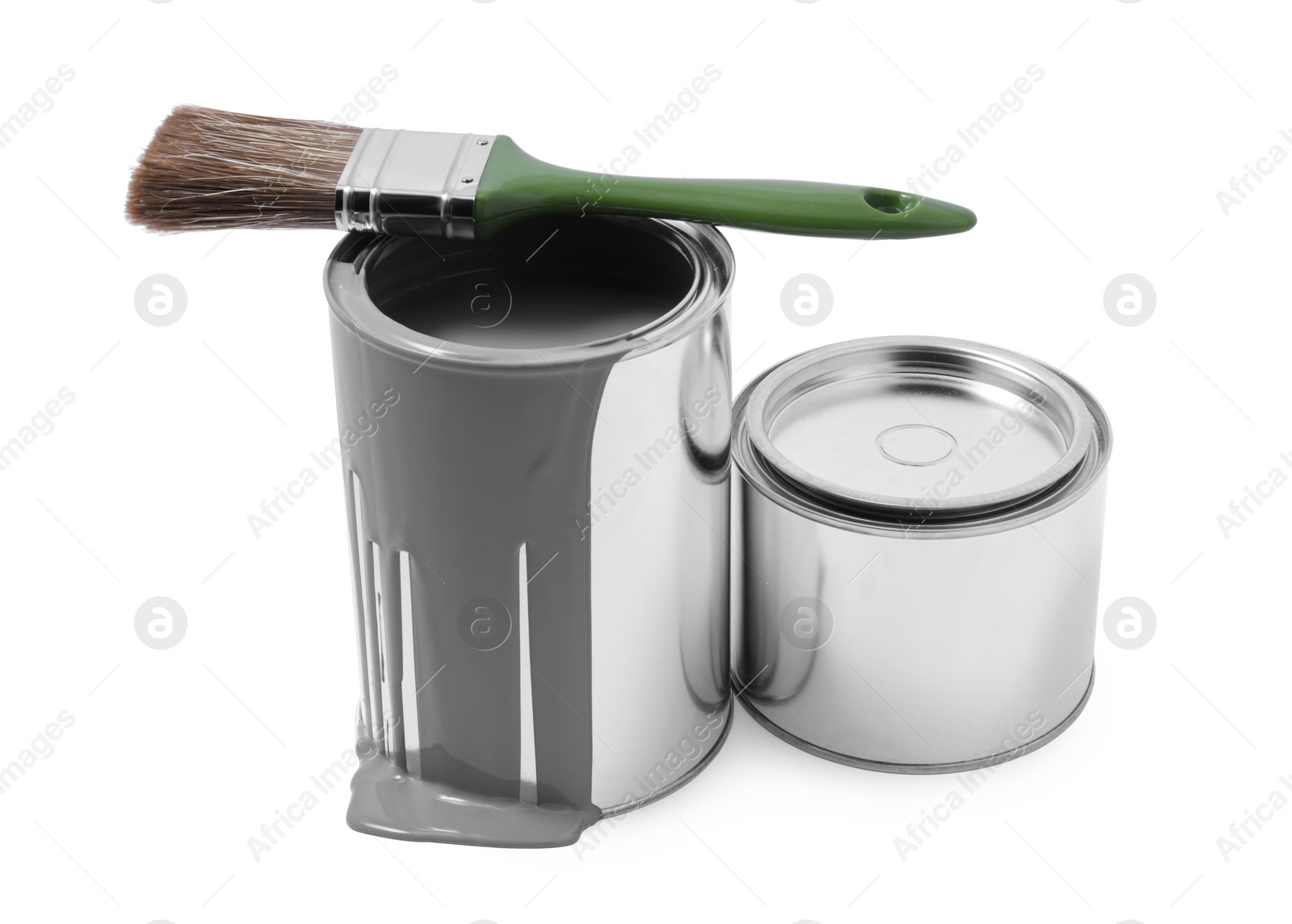 Photo of Cans of paint and brush isolated on white