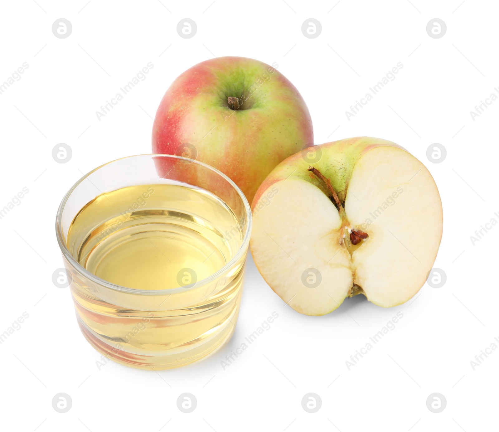 Photo of Apple vinegar in glass and fruits isolated on white