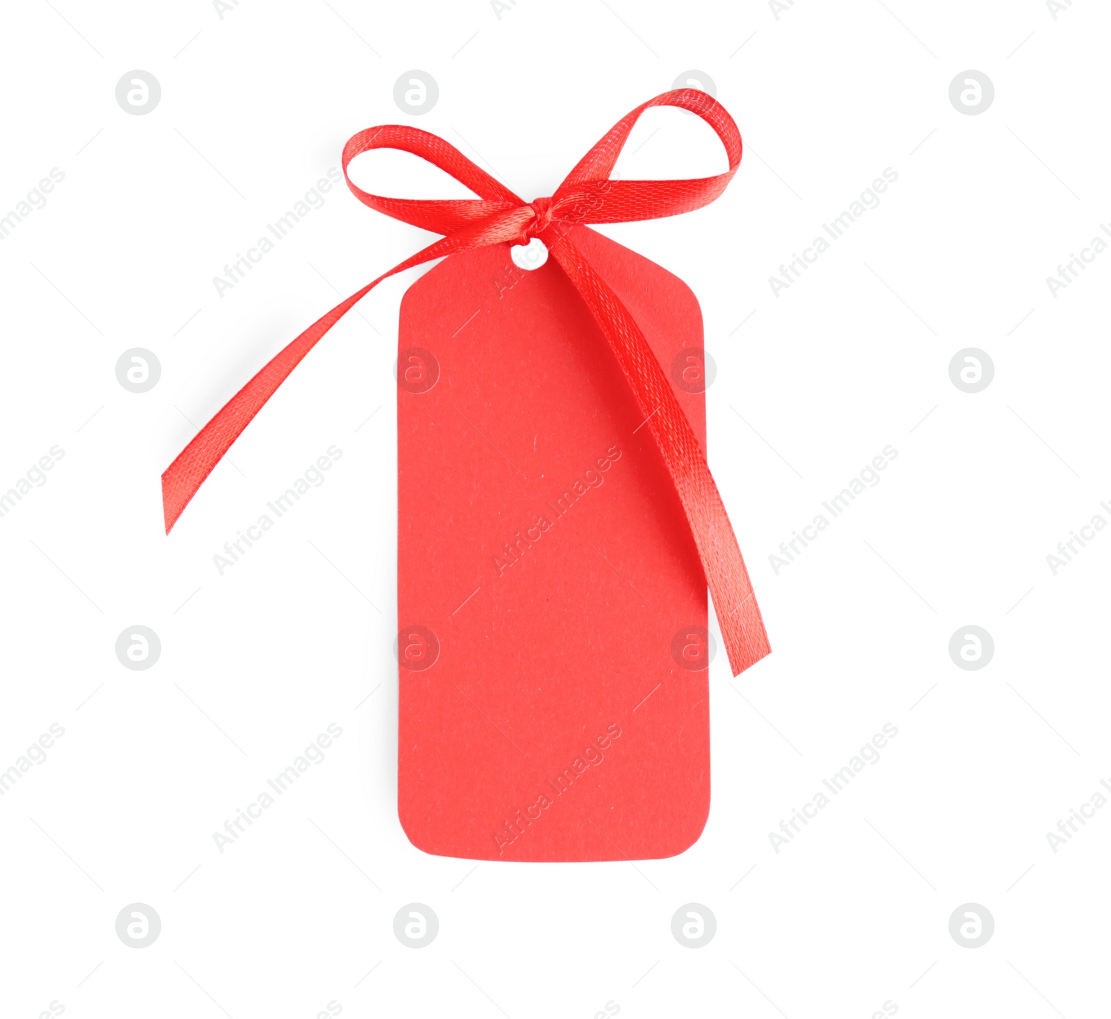 Photo of Blank red gift tag with satin ribbon on white background, top view