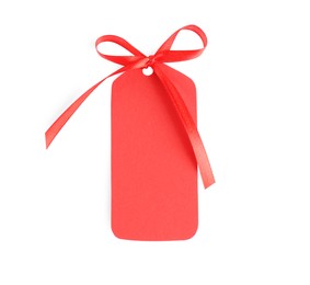 Blank red gift tag with satin ribbon on white background, top view