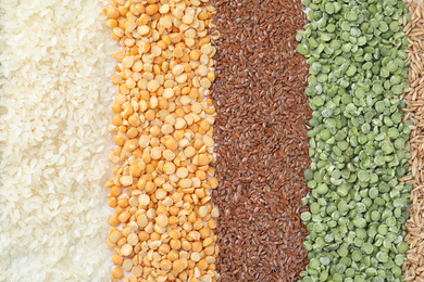 Photo of Different grains and cereals as background, top view