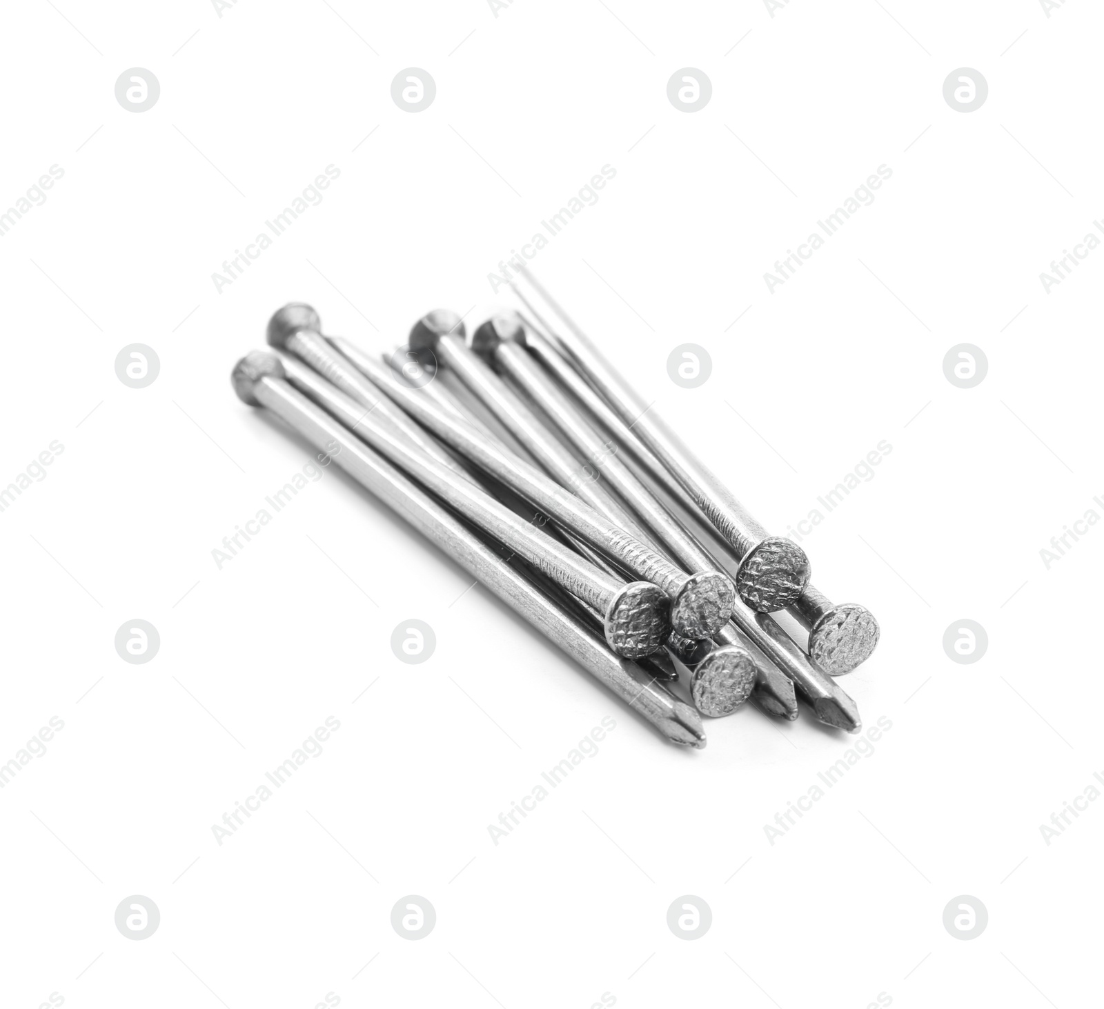 Photo of Pile of metal nails on white background