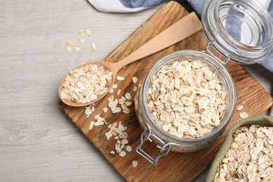 Photo of Oatmeal on white wooden table, flat lay