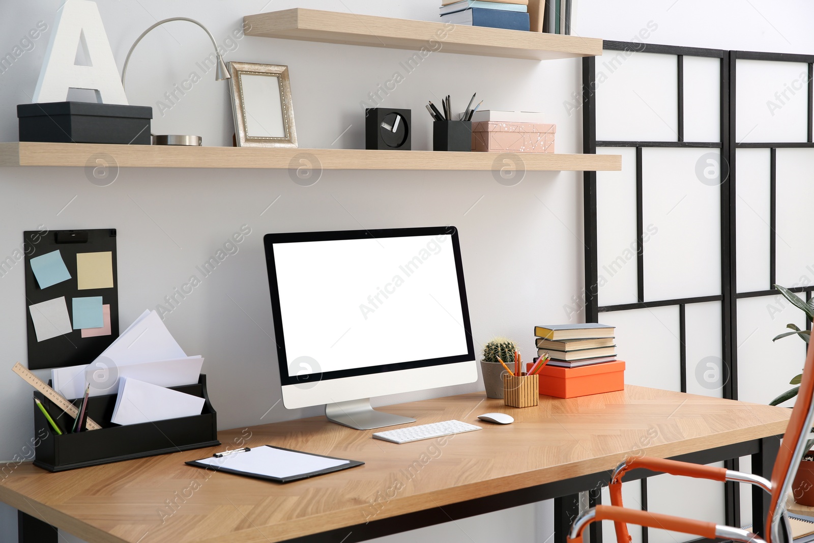 Photo of Modern computer on table in office interior. Stylish workplace