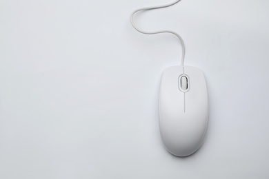 Photo of Wired computer mouse isolated on white, top view