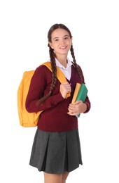 Photo of Teenage girl in school uniform with books and backpack on white background