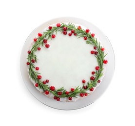 Photo of Traditional Christmas cake decorated with rosemary and cranberries isolated on white, top view