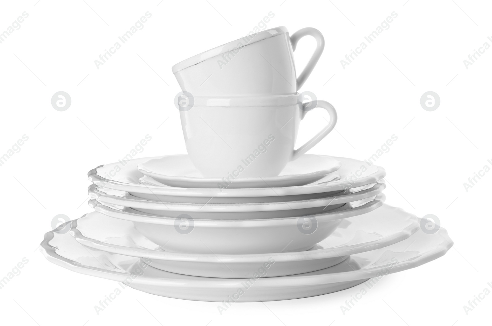 Photo of Set of clean tableware isolated on white