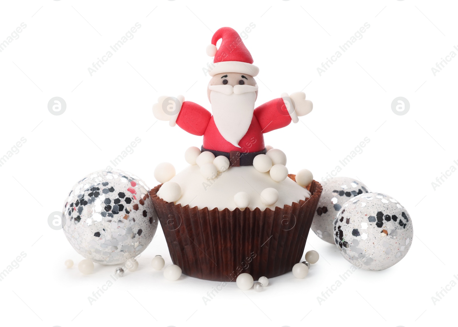 Photo of Tasty cupcake with Santa Claus and Christmas decor on white background